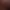 Pièce avec un canapé rouge, une table de travail et une lampe sur pied, vue depuis une autre pièce avec des murs en bois